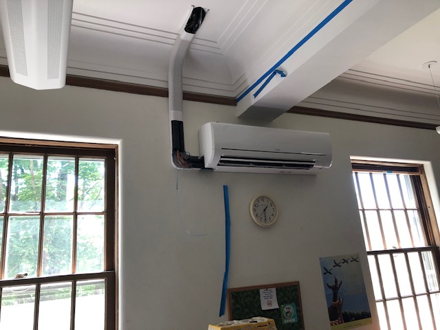 Photo showing HVAC vent and piping, as well as part of a window