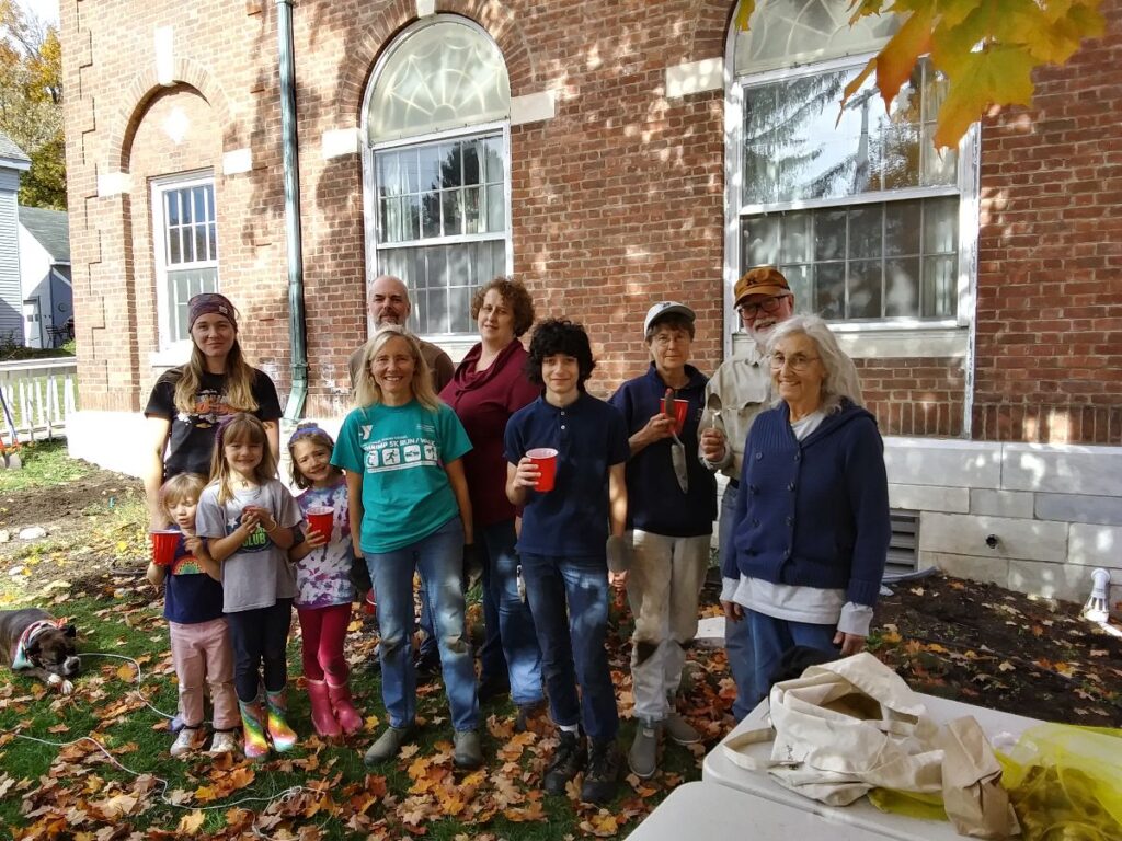 Photo of a group of people in front of the library