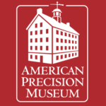 American Precision Museum logo. White building on a red background